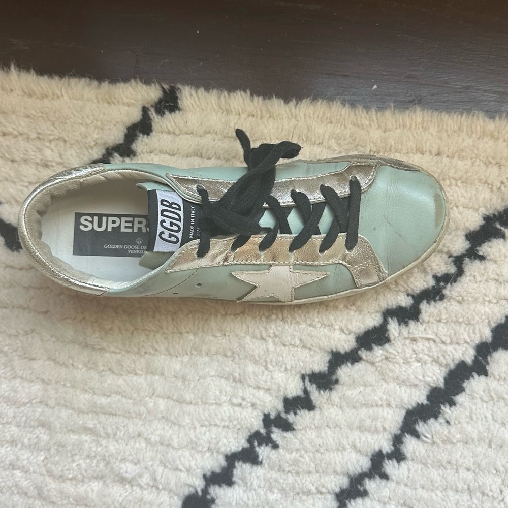 Golden goose size 38 gently used light blue/turquoise with black laces